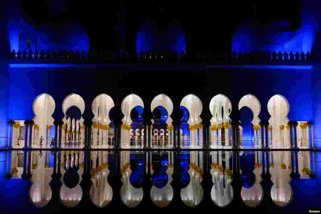 People walk through Sheikh Zayed Grand Mosque in Abu Dhabi, United Arab Emirates, Jan. 12, 2019.
