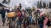 FILE - War-displaced people flee towards the city of Goma, eastern Republic of Congo, Nov. 15, 2022. More than 130 armed groups operating in the eastern Democratic Republic of Congo are creating havoc and terrorizing the population with their brutal, frequent attacks.