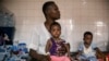FILE - Malnourished children wait for treatment in the pediatrics department of Boulmiougou hospital in Ouagadougou, Burkina Faso, on April 15, 2022. 
