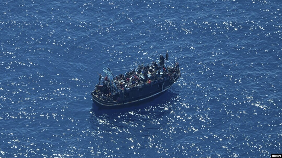 A boat in distress with about 400 people on board is pictured in the Mediterranean Sea in this handout obtained by Reuters on April 10, 2023. (Giacomo Zorzi/Sea-Watch/Handout via Reuters)