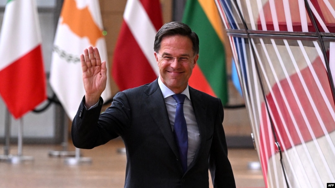 FILE - Outgoing Netherland's Prime Minister Mark Rutte waves as he arrives for the European Council Summit at the EU headquarters in Brussels, June 27, 2024. 