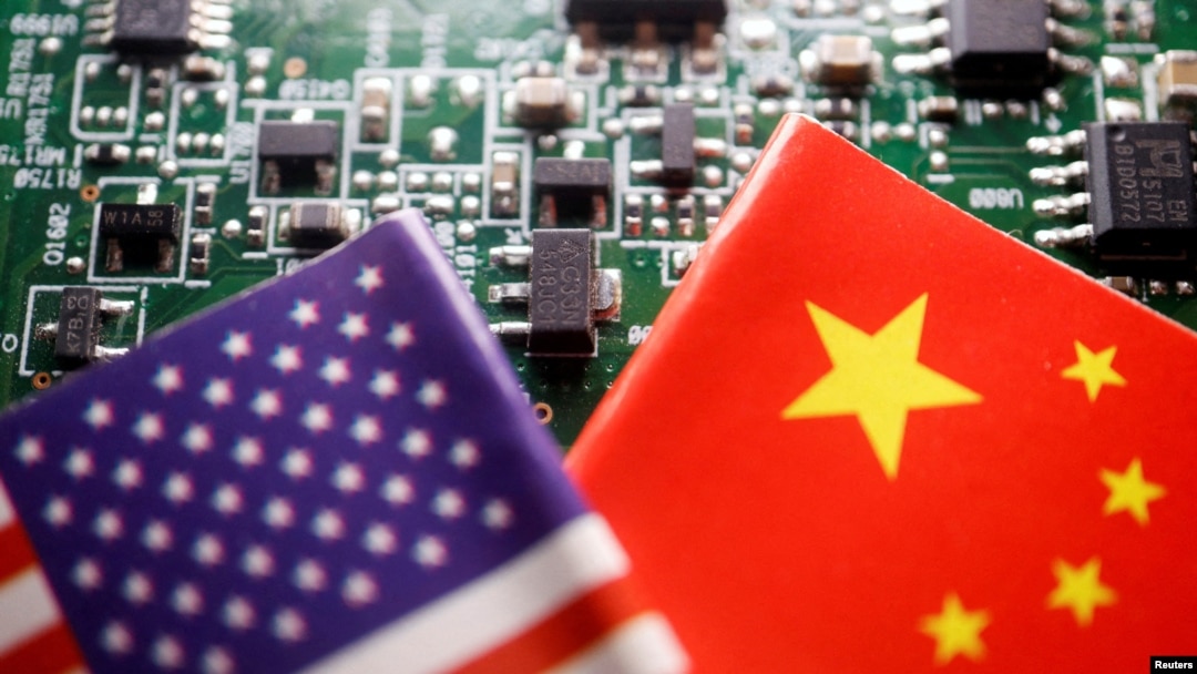 FILE - Flags of China and U.S. are displayed on a printed circuit board with semiconductor chips, in this illustration picture taken Feb. 17, 2023. 
