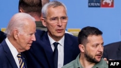 (From L) US President Joe Biden, NATO Secretary General Jens Stoltenberg and Ukraine's President Volodymyr Zelensky talk ahead of a working session on Ukraine during the NATO summit, in Vilnius, July 12, 2023. 