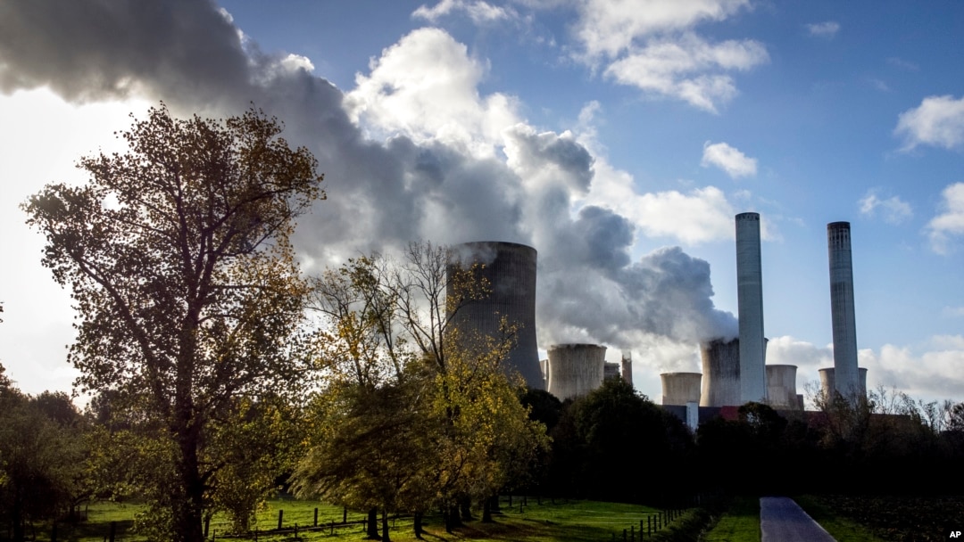 FILE - Steam rises from the coal-fired power plant Niederaussem, Germany, on Nov. 2, 2022. 