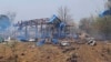 This photo provided by the Kyunhla Activists Group shows aftermath of an airstrike in Pa Zi Gyi village in Sagaing Region's Kanbalu Township, Myanmar, April 11, 2023. Witnesses said dozens of villagers were killed in an attack carried out by the country's military government.