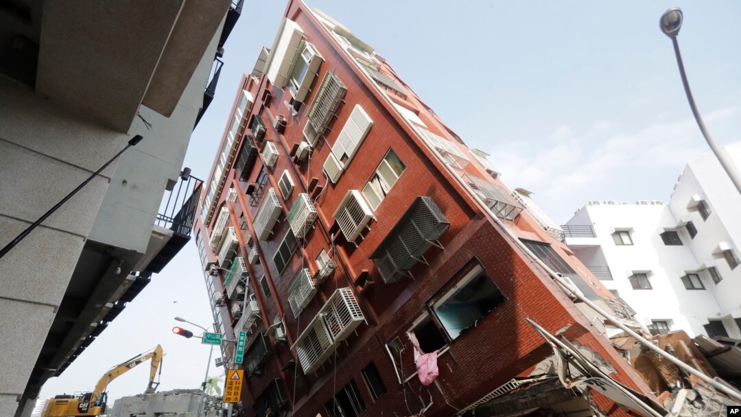 Debris surrounds a Hualien, Taiwan, building that collapsed during an earthquake the day before, April 4, 2024. Though Taiwan is no stranger to earthquakes, their toll on the island has been relatively contained because the community has prepared for them, say experts.