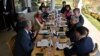 U.S. Treasury Secretary Janet Yellen, right center in blue jacket, listens to Nandan Nilekani, left, of Infosys during a meeting with Indian and U.S. technology business leaders on the sidelines of G-20 financial conclave in India, Feb. 25, 2023.