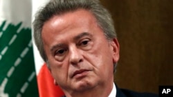 FILE - Riad Salameh, the former governor of Lebanon's central bank, listens during a press conference in Beirut on Nov. 11, 2019. An audit into the central bank obtained on Aug. 11, 2023, revealed yearslong misconduct by Salameh.