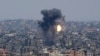Smoke and fire rise from an explosion caused by an Israeli airstrike on Gaza City, May 10, 2023.