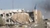 FILE - People inspect the rubble of the Canal Hotel after an explosion on Aug. 19, 2003, in Baghdad, Iraq. United Nations officials on Aug. 19, 2023, marked the 20th anniversary of the deadly attack on the U.N. headquarters in Baghdad.