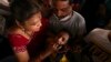 FILE - An asthma patient is administered a traditional fish medicine in Hyderabad, India, June 9, 2023.