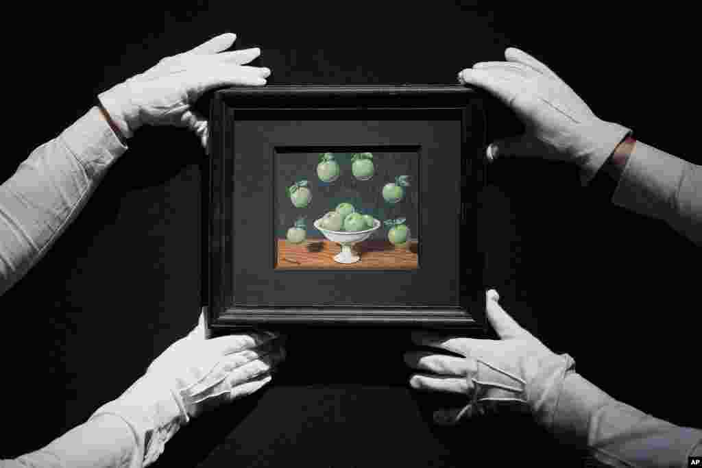 A painting by Rene Magritte called Le principe d'Archimede is displayed at Christie's auction rooms in London. The painting estimated at 450,000-650,000 UK Pounds (570,000-820,000 US Dollars) will be for auction in the The 20th / 21st Century: London Evening Sale and The Art of the Surreal Evening Sale on March 7.