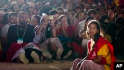 FILE - Young people in Lisbon, Portugal, on Aug. 5, 2023, attend a vigil with Pope Francis ahead of the 37th World Youth Day. Youth are the subject of a worldwide survey of people between the ages of 10 and 24 hoping to identify their hopes and aspirations.