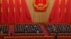 Delegates applaud as Chinese President Xi Jinping, left, arrives at the closing ceremony for China's National People's Congress (NPC) at the Great Hall of the People in Beijing, March 13, 2023.