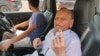 K.C. Gupta, showing his finger marked with the indelible ink that is placed on a voter's hand to denote they have cast their ballot, said at the polls in New Delhi on May 25, 2024, he hopes the next government in India will do more to improve people's lives. (Anjana Pasricha/VOA)