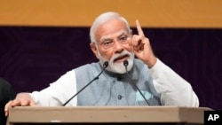 FILE — Indian Prime Minister Narendra Modi speaks in Gandhinagar, India, July 28, 2023. He has criticizes the INDIA alliance, which was formed by 26 opposition parties to put up a united fight against the BJP.