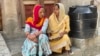 Rekha Sabharwal, right, who heads a women's community group in Mankrola village in India's Haryana state says unlike the past when the family dictated who to vote for, women now make their own choice. (Anjana Pasricha/VOA)