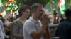 India's opposition Congress party leader Rahul Gandhi greets media personnel as he arrives at party headquarters in New Delhi, India, Aug. 4, 2023.