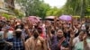Myanmar refugees living in Delhi pray outside UNHCR office on the occasion of World Refugee Day in New Delhi, India, June 20, 2023.