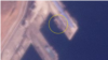 북한 라진항을 촬영한 19일 자 위성사진에 100m 길이의 선박(원 안)이 보인다. 사진=Planet Labs