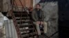 FILE - This photo taken Nov. 15, 2022, shows Anatoliy Stotskiy posing during an interview in Kherson, Ukraine. Stotskiy says he was held for weeks in detention, beaten and electrocuted by Russian and pro-Russian forces.