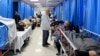 Patients and internally displaced people are pictured at Shifa hospital in Gaza City on Nov. 10, 2023, amid ongoing battles between Israel and Hamas. 