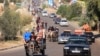 Palestinians with their belongings leave Gaza City as they flee from their homes following the Israeli army's warning, Oct. 13, 2023. 