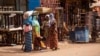 FILE - Women displaced from Djibo, Burkina Faso, gather in Ouagadougou, Burkina Faso, where they sought refuge over two years ago, June 2, 2023.