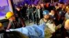 Miners carry the body of a victim in Amasra, in the Black Sea coastal province of Bartin, Turkey, Oct. 14, 2022, after an explosion in a coal mine. 