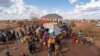 FILE - Water is distributed at a camp for displaced people on the outskirts of Dollow, Somalia, Sept. 20, 2022. 