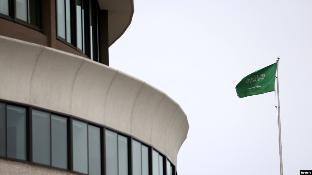 FILE - The flag of Saudi Arabia flies above the Saudi Arabia embassy near the Watergate Complex in Washington, Feb. 26, 2021. 