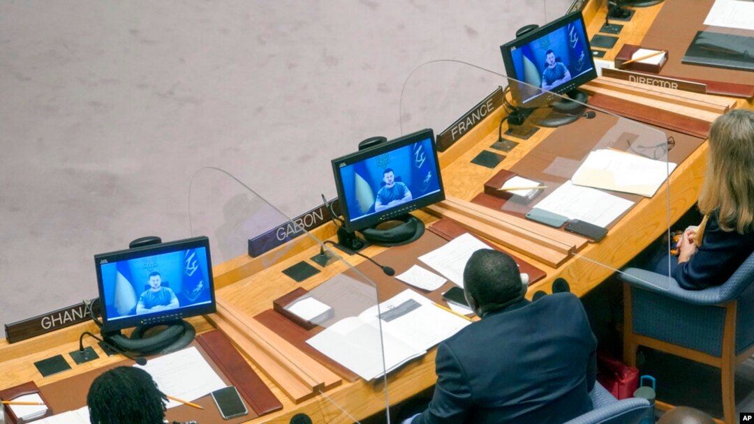 FILE - Ukrainian President Volodymyr Zelenskyy addresses the Security Council via video link during a meeting on threats to international peace and security, at United Nations headquarters, Aug. 24, 2022.