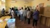 FILE - Voters queue to cast their votes at a polling station in general elections, in Luanda, Angola, Aug. 23, 2017. 