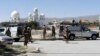 FILE - Pakistani soldiers stand guard at the site where two Chinese missionaries was kidnapped in the neighborhood of Jinnah town in Quetta on May 24, 2017.