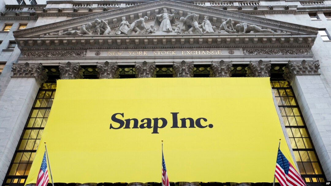 A banner for Snap Inc. hangs from the front of the New York Stock Exchange, March 2, 2017, in New York. 