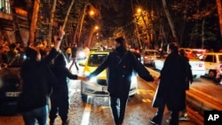 FILE - Women protest the death of Mahsa Amini who was detained by the morality police, in Tehran, Oct. 1, 2022, in this photo taken by someone not employed by AP and obtained by AP outside Iran.The death penalty is used to create fear and prevent more protests, say rights groups.