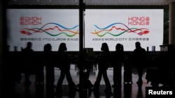 FILE - Travelers at Hong Kong International Airport after the lifting of coronavirus disease (COVID-19) movement controls in Hong Kong, China, Dec. 14, 2022.