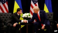 FILE - In this Sept. 25, 2019, photo, then-President Donald Trump meets with Ukrainian President Volodymyr Zelenskyy in New York City. During a call with Zelenskyy on Friday, Trump promised that if he is elected president, he would end the war Russia launched against Ukraine. 