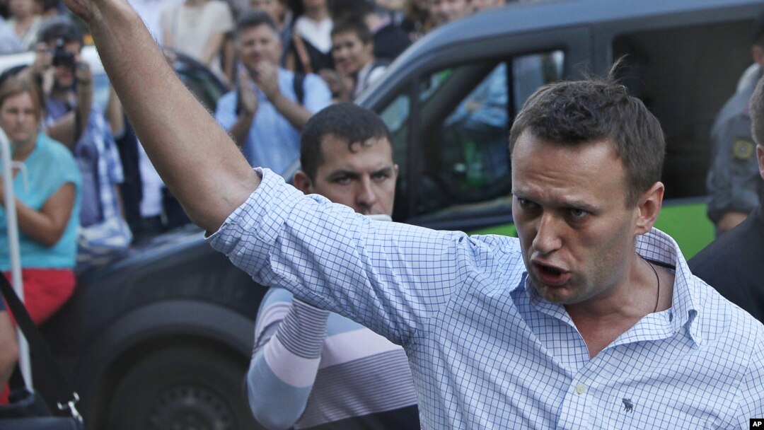 FILE - In this file photo taken on Friday, Aug. 17, 2012, Russian protest leader Alexei Navalny gestures as he walks outside a court in Moscow, Russia. 