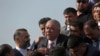 FILE - Gen. Abdul Rashid Dostum, center, and members of his entourage disembark on arrival at Kabul International Airport in Kabul, Afghanistan, July 22, 2018. 