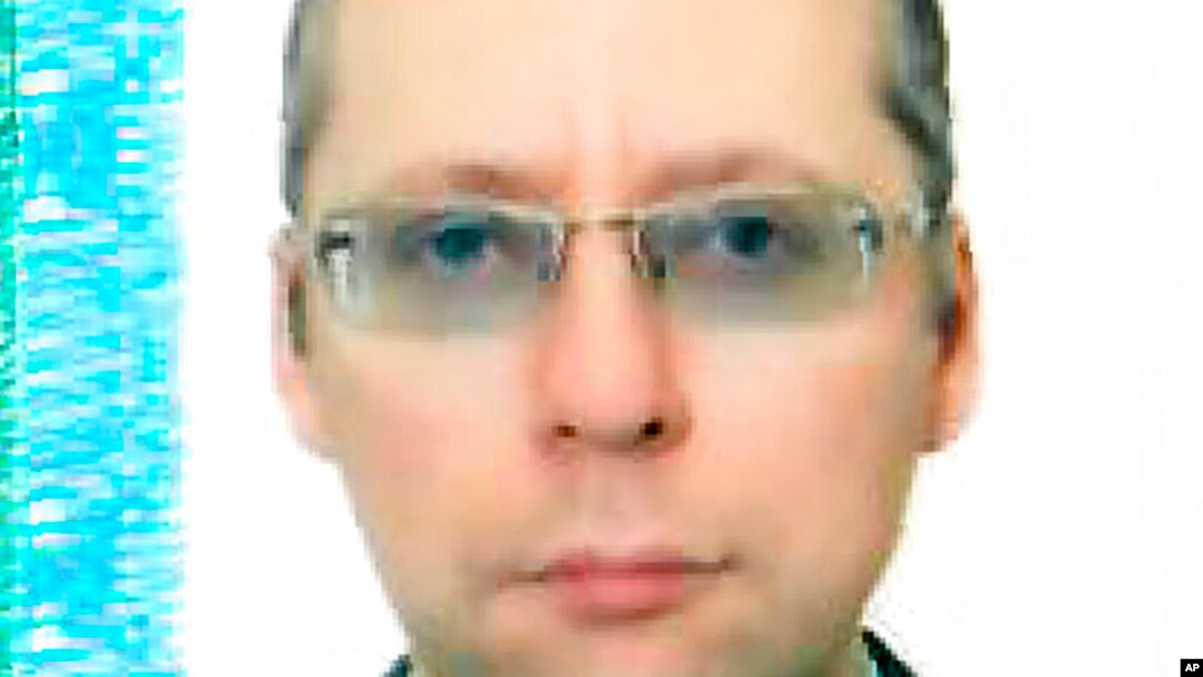 An undated image taken with permission from the passport photo page of Russian diplomat Boris Bondarev.