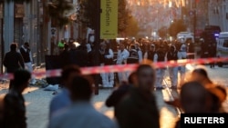 Police and emergency service members work at the scene after an explosion on busy pedestrian Istiklal street in Istanbul, Nov. 13, 2022. 