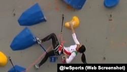 FILE - This screenshot from a social media post by @iwsports shows Elnaz Rekabi competing without a hijab in South Korea. 