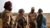 FILE - Malian Armed Forces (FAMa) and French soldiers of the "Belleface" Desert Tactical Group (GTD) conduct an area control operation in the Gourma region during the Operation Barkhane in Ndaki, Mali, July 29, 2019.