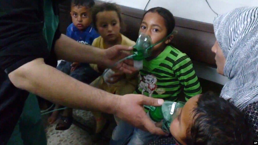 In this image taken from video obtained from the Shaam News Network, posted on April 16, 2014, an anti-Bashar Assad activist group, which has been authenticated based on its contents and other AP reporting, children are seen receiving oxygen in Kfar Zeita