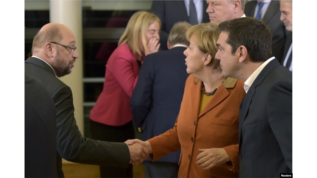 From left, European Parliament President Martin Schulz, Germany's Chancellor Angela Merkel and Greece's Prime Minister Alexis Tsipras chat after a meeting about the Balkan refugee crisis with leaders from central and eastern Europe, Oct. 25, 2015.
