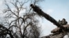 A Ukrainian serviceman rides on a battle tank in Bakhmut, eastern Ukraine, Feb. 5, 2023.