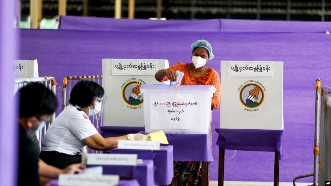 A voter casts ballot at a polling station on Nov. 8, 2020, in Yangon, Myanmar. A court in Myanmar on Friday, Sept. 2, 2022 sentenced the country’s ousted leader Aung San Suu Kyi to three years' imprisonment after finding her guilty of involvement in election fraud.