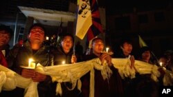 Exile Tibetans participate in a candlelit vigil Dharmsala, India, to express solidarity with a young Tibetan Dorjee Lhundrup who allegedly immolated himself in protest against Chinese rule, November 4, 2012. 
