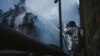 A firefighter extinguishes a fire at a critical power infrastructure, which was hit during Russia's drones attacks in Kyiv, Ukraine, Dec. 19, 2022.